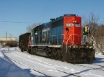 The conductor keeps watch as the little train nears the WSOR yard